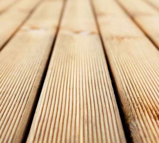 A close up of the wood planks on a deck