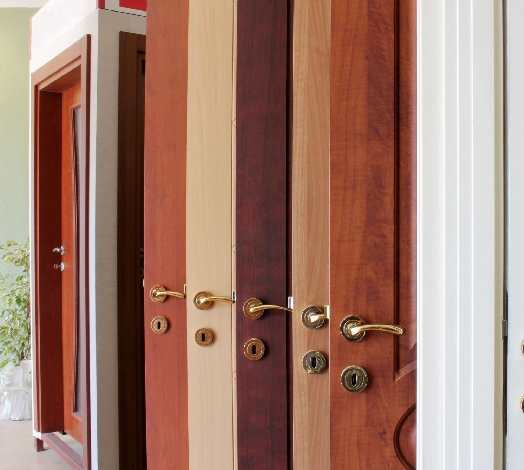 A door with several different colored wood panels.