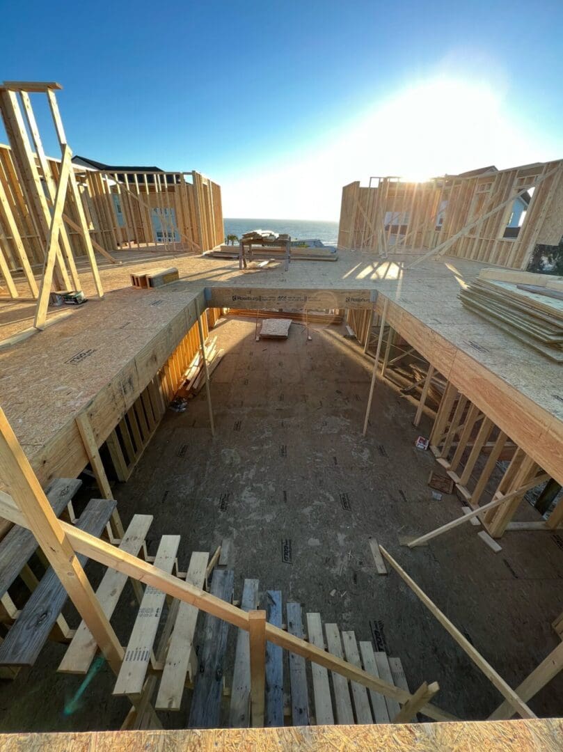 A view of some wooden beams in the middle of construction.